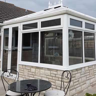 new conservatory with table and chairs